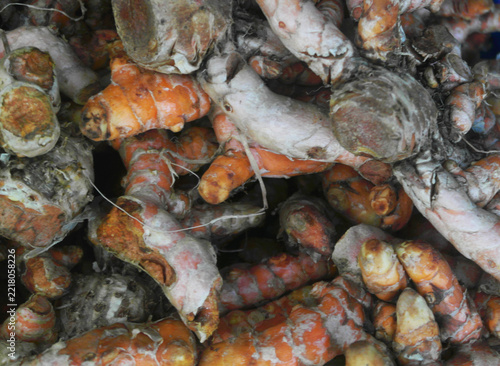 Fresh turmeric roots as background	