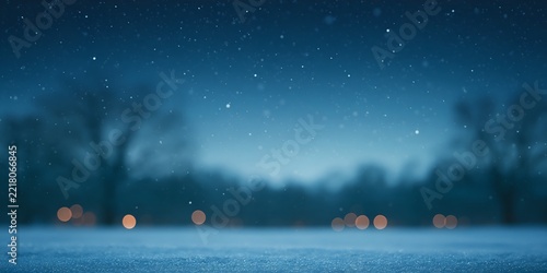 Frozen lake reflects faint lights under snowy night sky