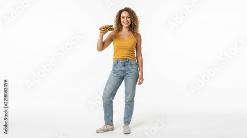 Happy young woman holding a fresh whole wheat sandwich isolated on a