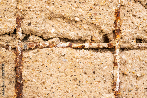 Cracked Concrete with Exposed Rusty Rebar Close-Up