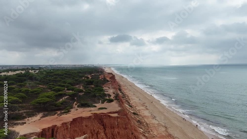 Beautiful view of Falesia beach in the foggy morning, Stunning Cliffs and touquoise water, Algarve