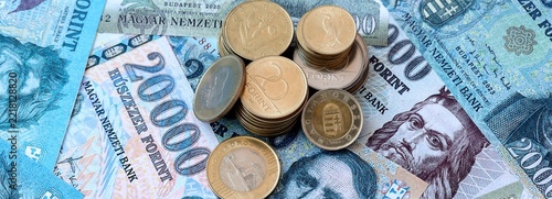 Fotografie Hungarian forint money banknotes and coins on table