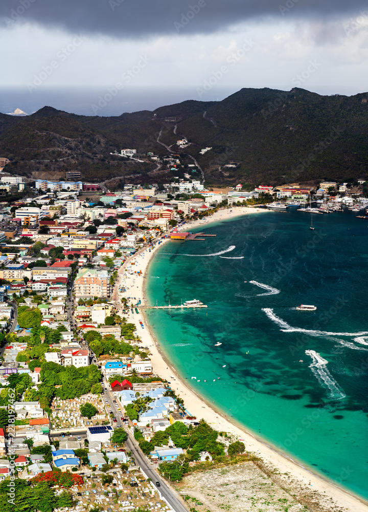 Fototapeta premium Aerial view of Great Bay Beach with turquoise water and the urban skyline of Philipsburg in Sint Maarten, Caribbean Netherlands
