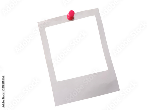 Empty picture frame attached to transparent board with pushpin