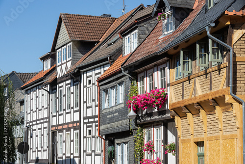 Traditional timber-framed facades with flowers in Goslar, Germany