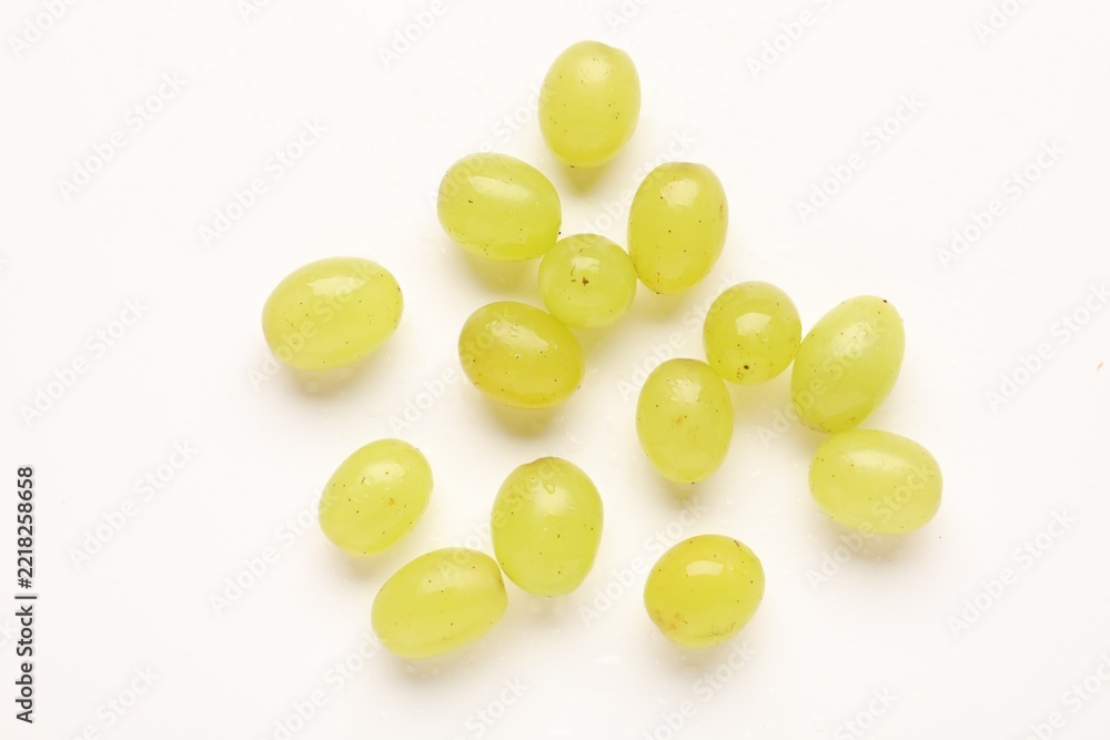 Fototapeta premium Fresh ripe grapes on white background, flat lay