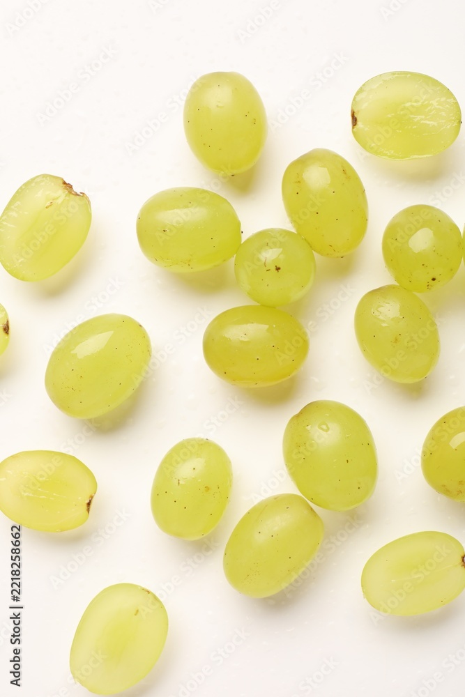 Fototapeta premium Fresh ripe grapes on white background, flat lay