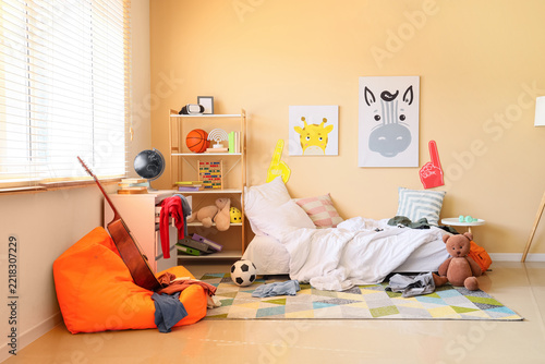 Childhood development and messy bedroom, interior of a kid room with toys and unmade bed reflecting daily life and growth in a cozy home environment