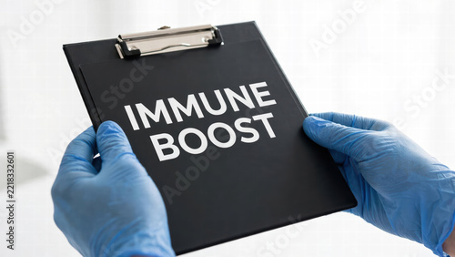 Immune boost clipboard with gloved hands in medical setting, health concept, preventive care, immunity, black folder, white background, clinical scene