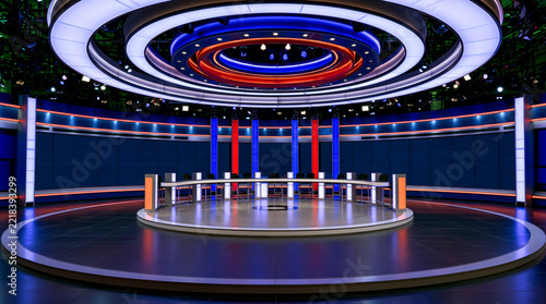 Modern television news studio with circular ceiling lights and curved discussion desk