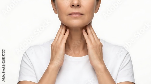 Woman experiencing neck or throat pain