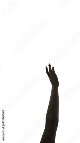 Close up of a black silhouette hand and arm reaching upward against white background