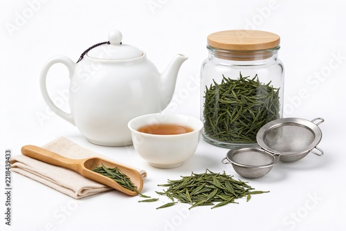 Tea Set Flat Lay with Ceramic Teapot Cup Green Tea Leaves Strainers and Linen Cloth