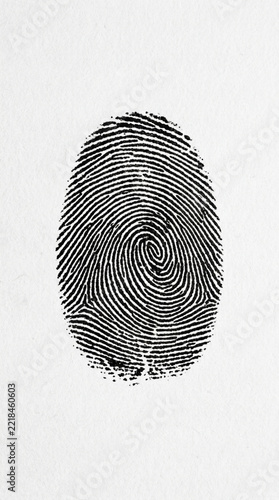 Close up of a Black Fingerprint on White Textured Paper Identity Concept