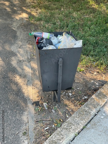 Overflowing Public Metal Trash Can Full Of Plastic Bottles Waste Outdoor Park
