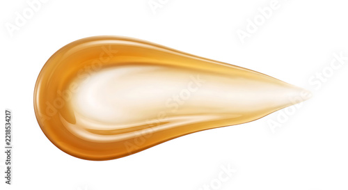 Single horizontal smear of golden honey or cosmetic gel isolated on a solid black background