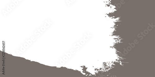 Brown grunge texture overlay with rough jagged edge on a transparent background