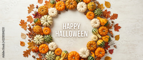 Happy Halloween Wreath: Pumpkins, Gourds & Autumn Leaves on White Wood Background
