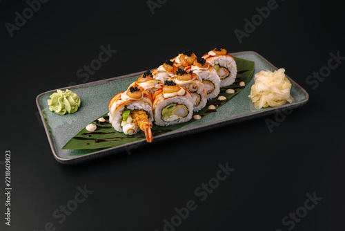 Obraz na plátně Shrimp tempura sushi rolls on plate with wasabi and ginger