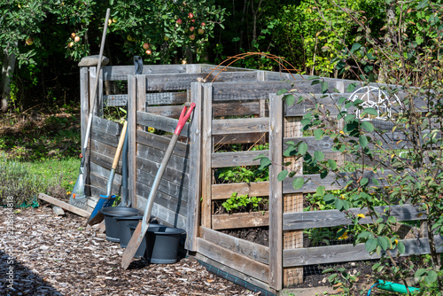 Homemade garden compost with garden tools and buckets