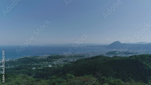 A drone shot of Takasakiyama and Beppu Bay in Oita Prefecture, Japan