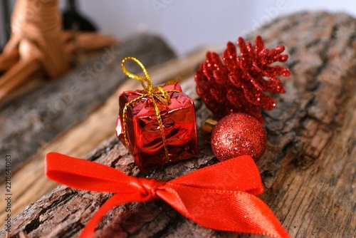red christmas deco on firewood background  - merry christmas background - christmas card background 