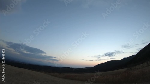 A time-lapse shot of autumn grasslands in Oita Prefecture, Japan, at sunset
