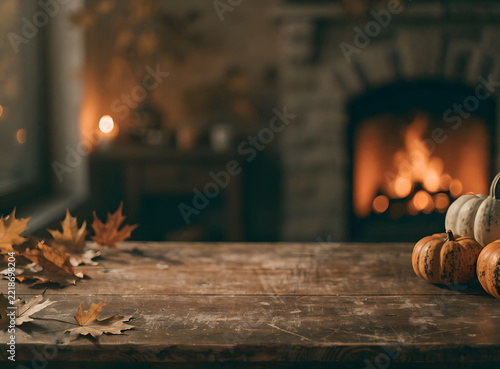 Rustic Thanksgiving table background realistic photo with warm candlelight, pumpkins and autumn leaves, vertical composition

