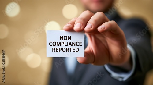 Closeup Hand Showing Non Compliance Reported Business Card
