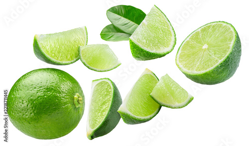 Fresh green lime fruits, including whole lime, halves, slices, and dark green leaves, isolated on a white background. Clipping Path.