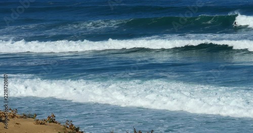 Slow-motion video of a surfer braving heavy swell