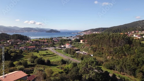 Historic poio monastery building standing among vineyards and green hills of galicia