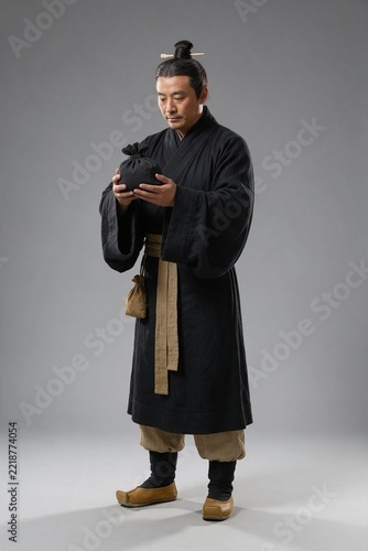 Chinese Qin Dynasty Alchemist Holding a Medicine Pouch