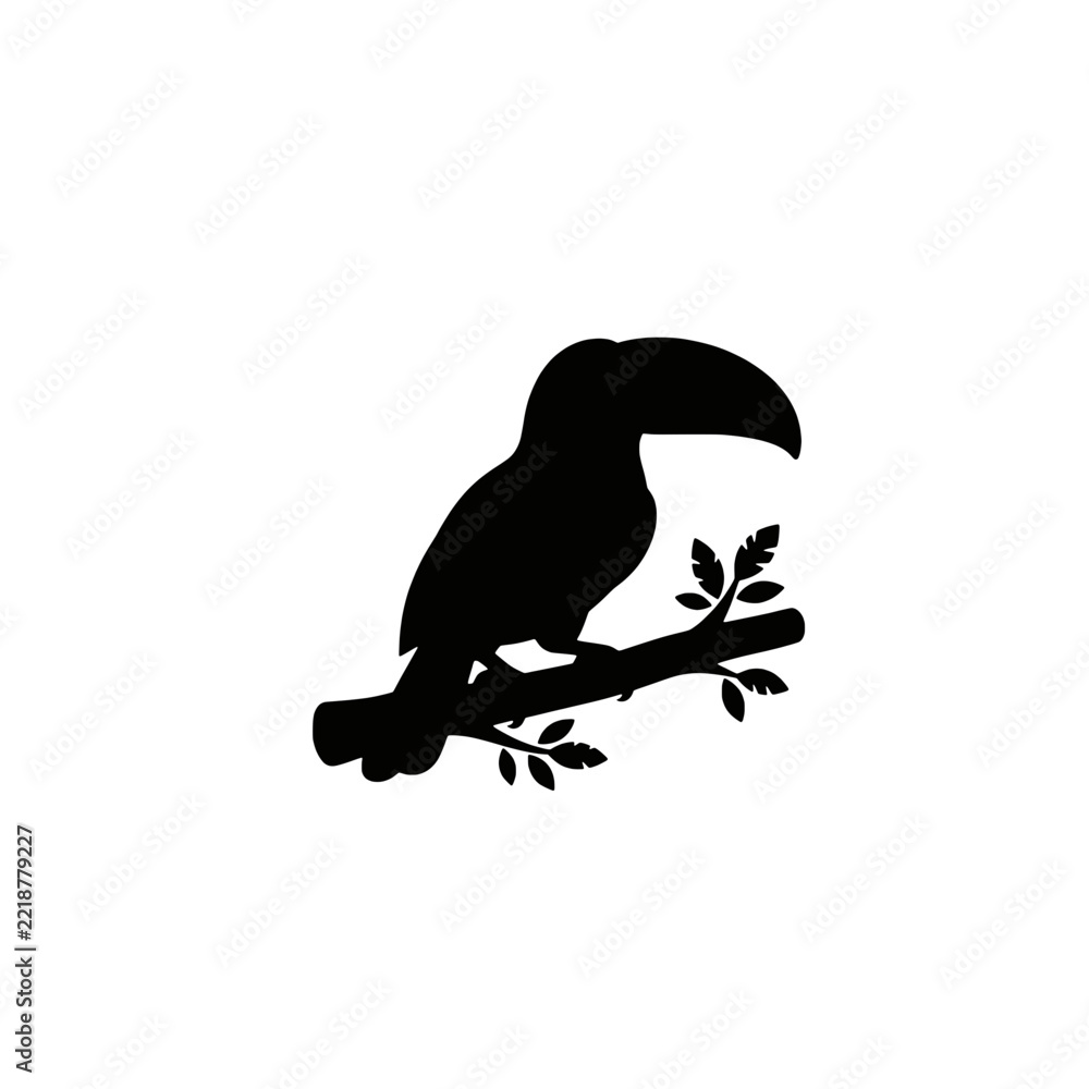 Fototapeta premium Black silhouette of a toucan bird perched on a tree branch