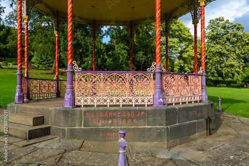 Detail of the painted Victorian cast iron bandstand in Lincoln Arboretum, an early example of a Victorian municipal park in the city of Lincoln, England 