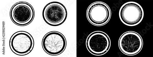 Set of four grunge rubber stamp circles with distressed texture and circular borders isolated on transparent background