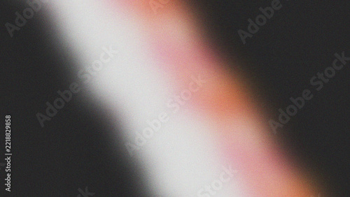 Abstract grainy gradient background with soft glowing diagonal light beam and dark texture