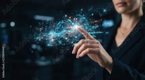 Businesswoman touching digital interface with glowing data