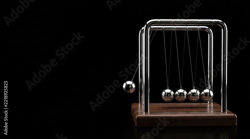 Newton's cradle poster. The pendulum in action. Dark background.