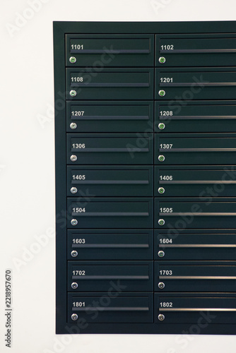 Close Up Of Numbered Mailboxes In Apartment Building