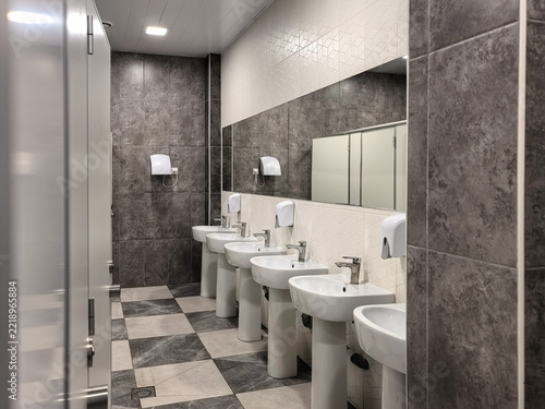 Row of Sinks and Mirrors in Public Restroom Interior