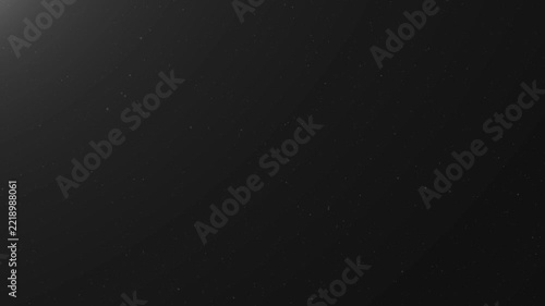 Abstract dark background with soft glowing light texture and subtle dust particles floating in the air for cinematic overlay effects