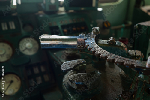 Worn control lever in a vintage locomotive cab in Japan