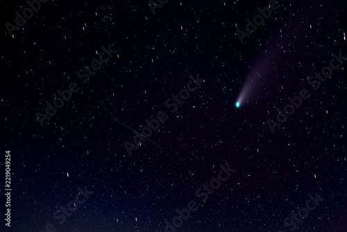 Abstract cosmic background with a comet