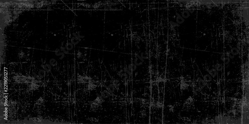 Dark black grunge texture background with scratched vintage surface and distressed vignette border