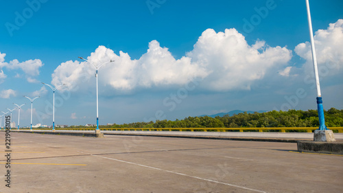 Empty Road Bridge with Mountain View Under a Beautiful Blue Sky