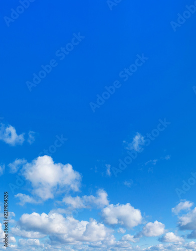 Blue Sky background with tiny Clouds. Blue sky and white clouds. Bfluffy cloud in the blue sky background