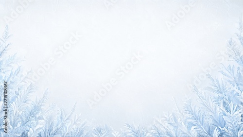 Icy frost texture and fern leaves forming a winter border on light background
