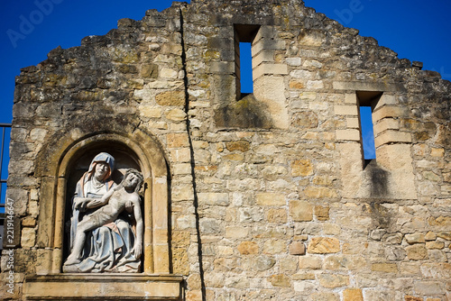 Luxembourg City, Luxembourg, May 15th 2026: A stone Pietà relief sculpture embedded in an arched niche within the historic fortified stone wall at Bock Casemates in Luxembourg City.