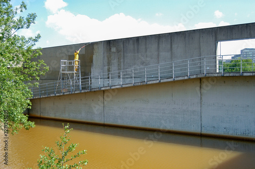 Facade Cleaning with a Pressure Washer on Scaffolding on a Steep Slope